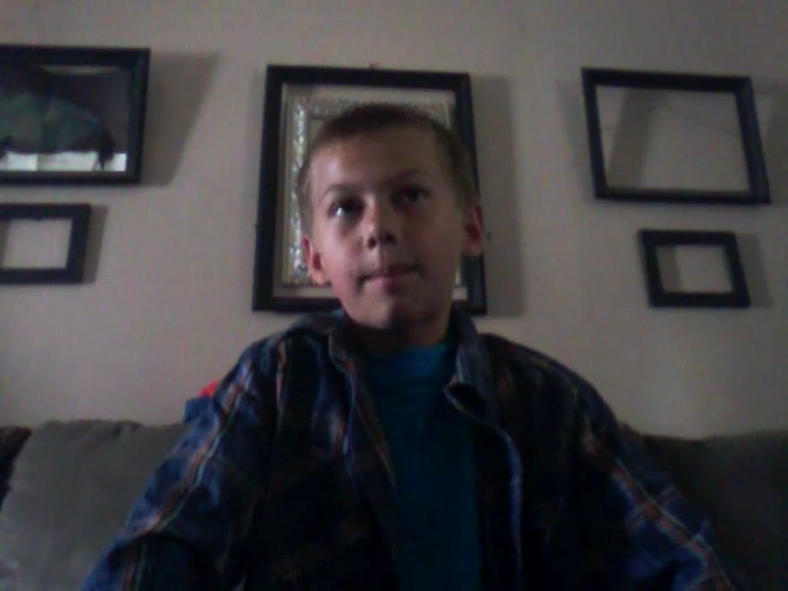 Eight-year-old Mikey filming content.