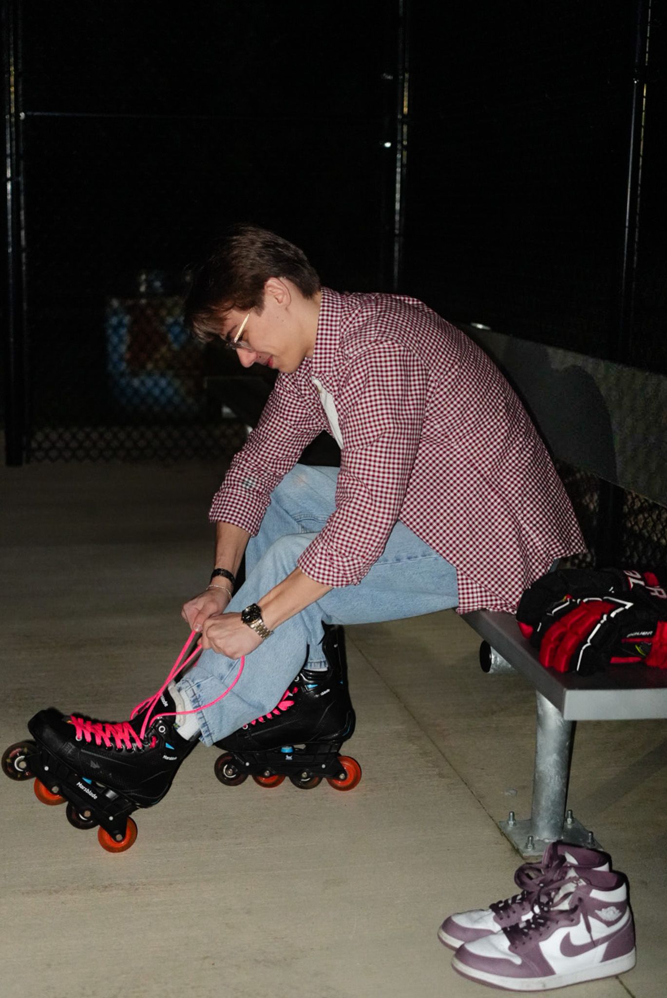 Mikey tying up for inline hockey.